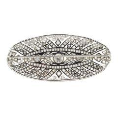 Broche oval de diamantes
